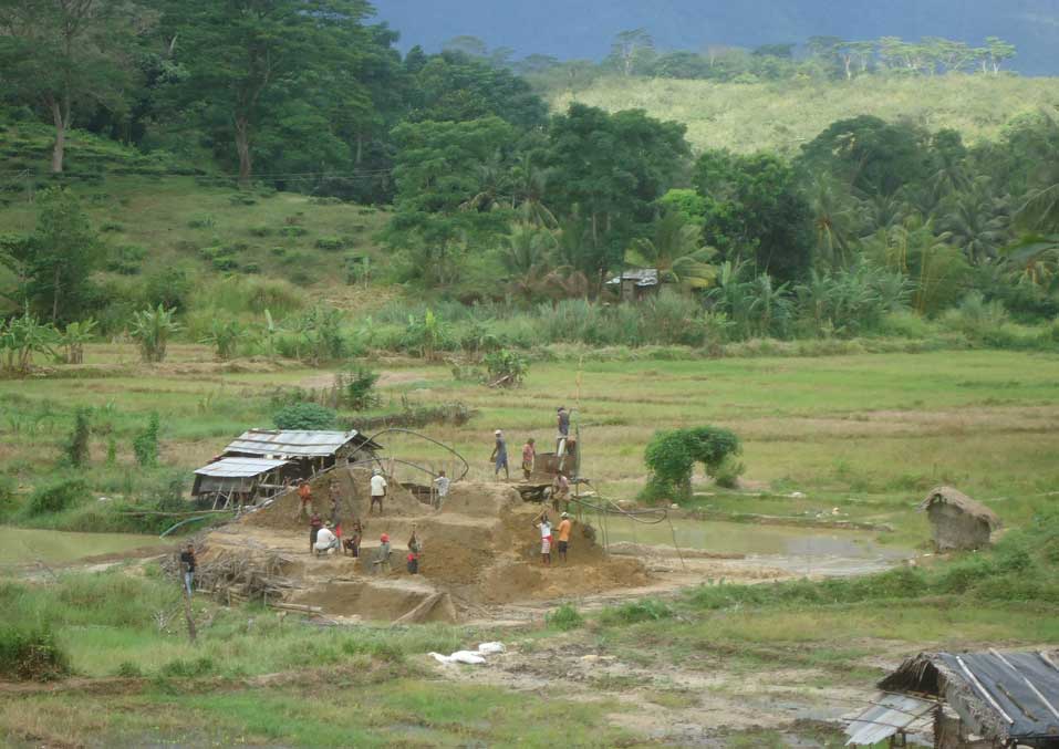 ASM sapphire mine, with pump house, spoil heap and sump, Sri Lanka.