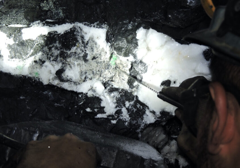 An emerald being removed from a large-scale underground mine in Colombia. This is an example of a primary deposit where emeralds are hosted within veins.
(Photo courtesy of Muzo Emerald Colombia).